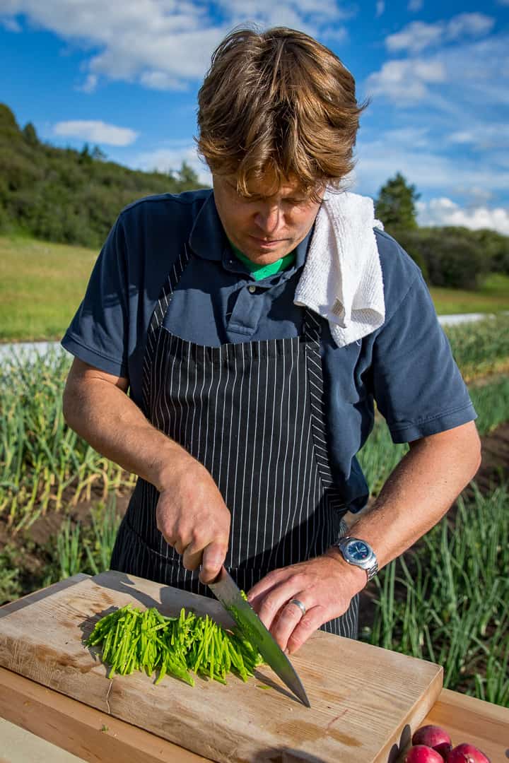 Chef Eric Wilson Julienning a pile of snow peas for the Eat The Rainbow Salad