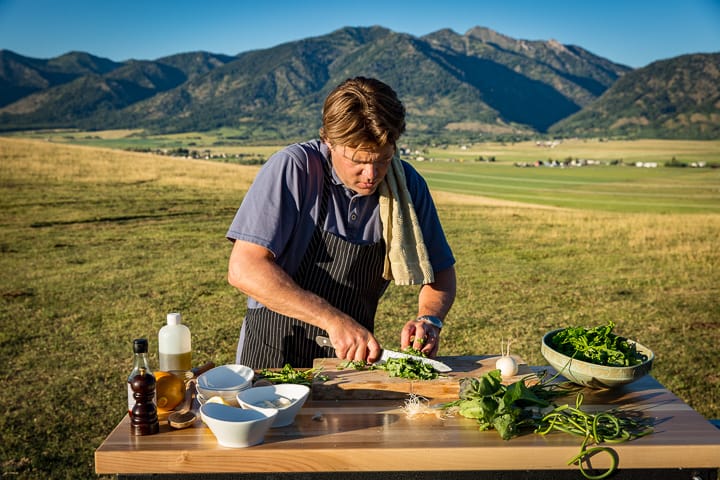 Eric Wilson prepping the Ton-O-Greens Spare Rib Curry outside on the Robinson Family Farm and Ranch
