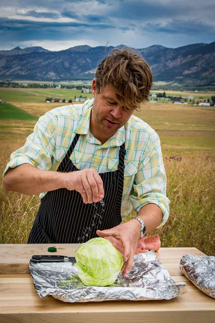 Eric Wilson salting the cabbage before coal roasting