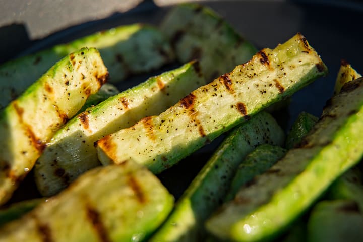 Beautiful grill marks on a pile of grilled summer squash