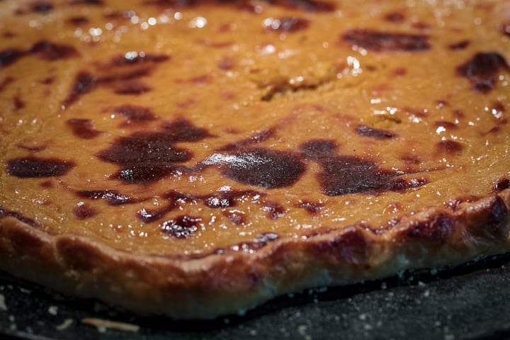 close up on Caramelized top on Wood Fired Pumpkin Crostata and delicately charred crust