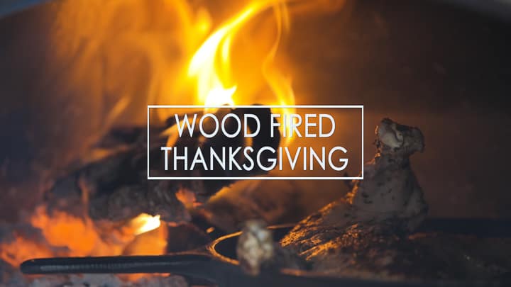 Wood Fired Thanksgiving text logo over turkey roasting in a wood fired oven